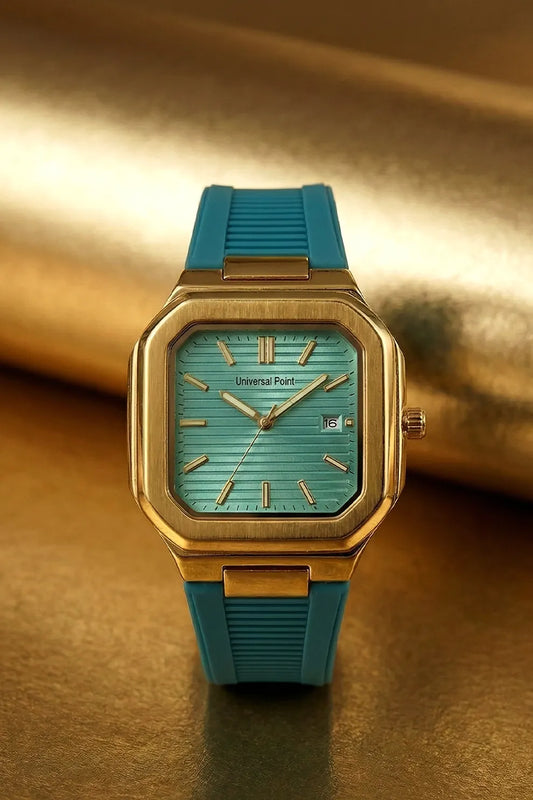 Watch with turquoise strap and gold case on a reflective gold surface